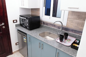 Departamento, 1 habitación, para fumadores, patio | Cocina privada