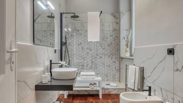 Apartment, 1 Bedroom, Patio | Bathroom amenities | Hair dryer, bidet, soap, shampoo