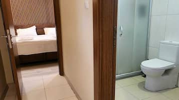 Standard Double Room | Bathroom | Shower, hair dryer, slippers, towels