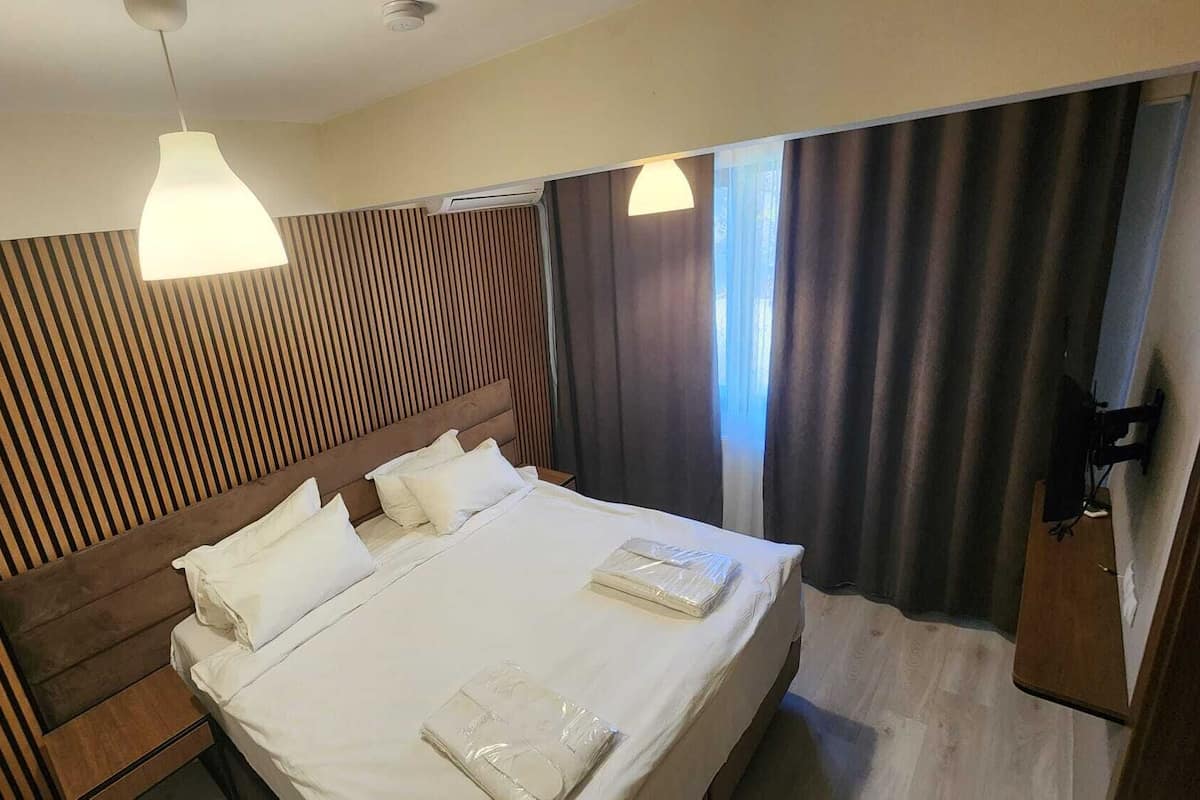 Shower, hair dryer, slippers, towels