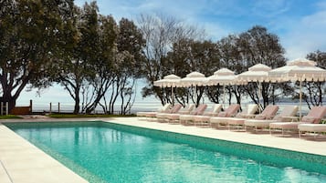 Indoor pool, outdoor pool, free pool cabanas, pool umbrellas