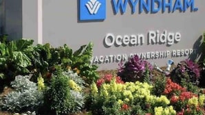 A sign for Wyndham Ocean Ridge Vacation Ownership Resort with a logo and name.