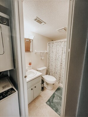 Combined shower/tub, hair dryer, towels, soap