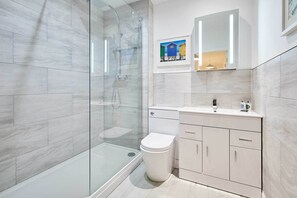Bathtub, hair dryer, shampoo