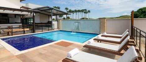 Outdoor pool, open 9:30 AM to 8:00 PM, pool umbrellas, pool loungers