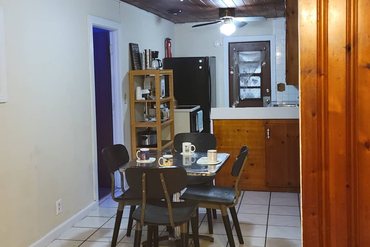Family House, 3 Bedrooms, Garden View | Living area | 50-inch Smart TV with cable channels, TV, fireplace