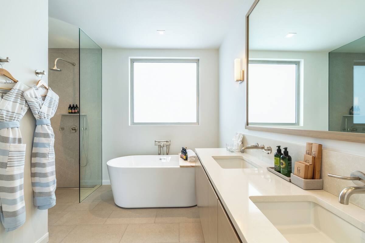 ocean view three bedroom reserve villa | bathroom | rainfall showerhead, free toiletries, hair dryer, bathrobes