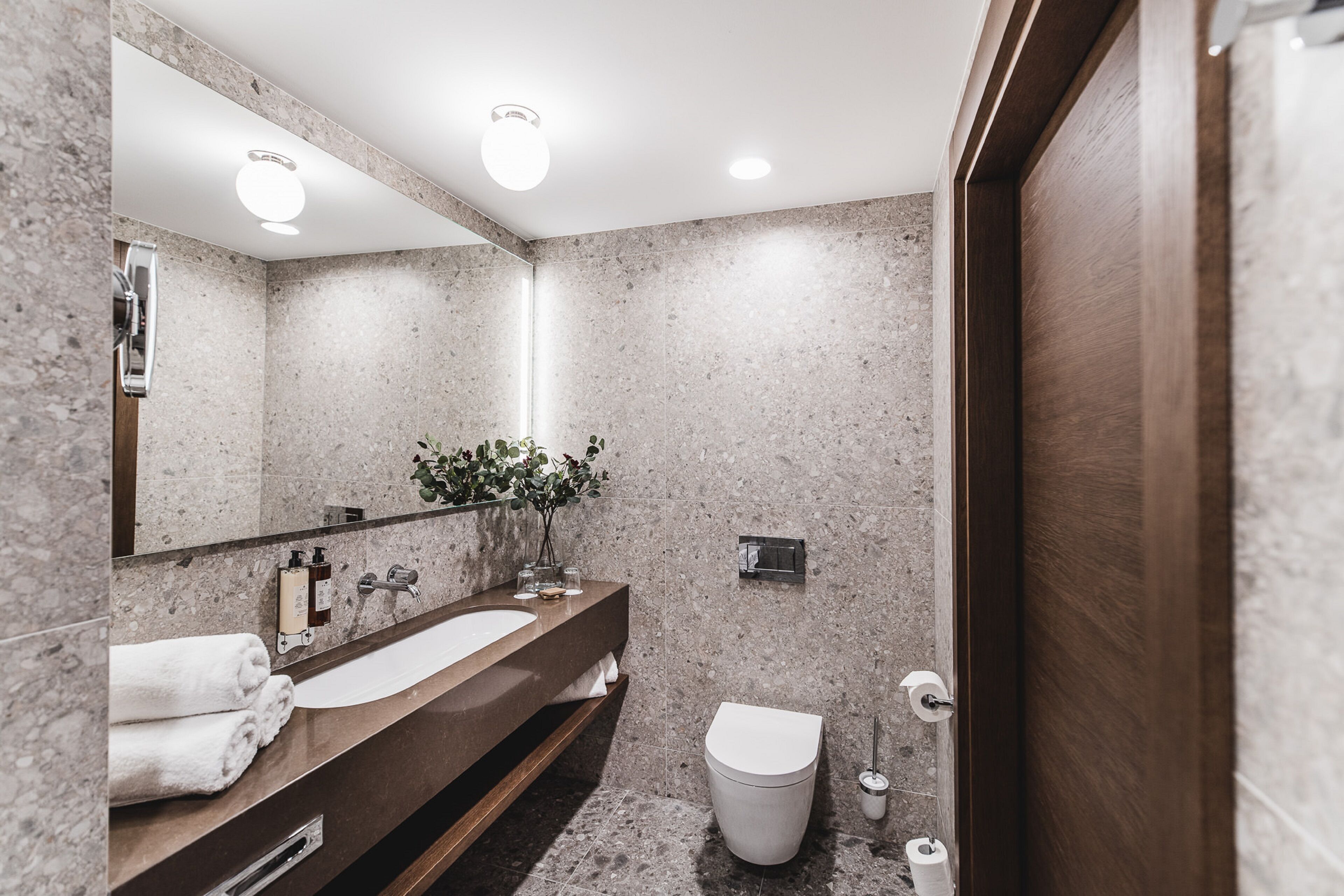 grand apartment | bathroom | shower, rainfall showerhead, hair dryer, bathrobes