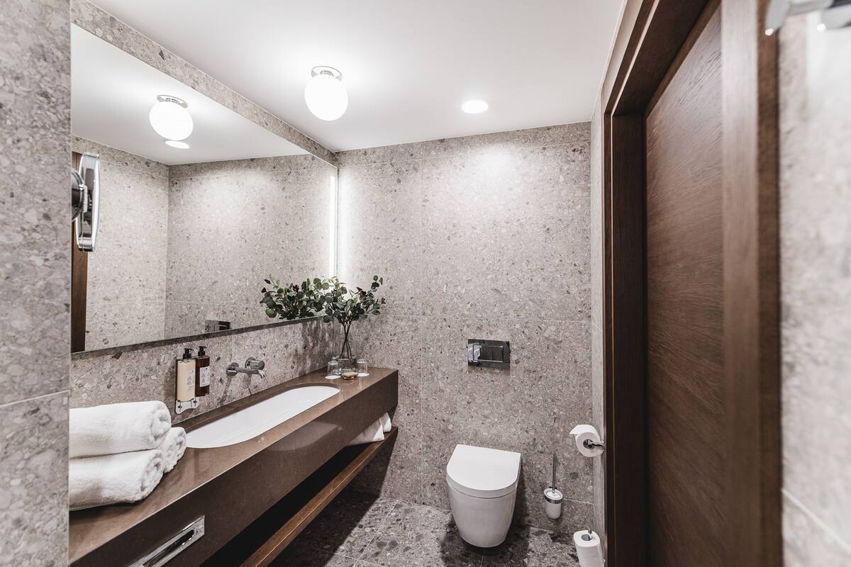 grand apartment | bathroom | shower, rainfall showerhead, hair dryer, bathrobes