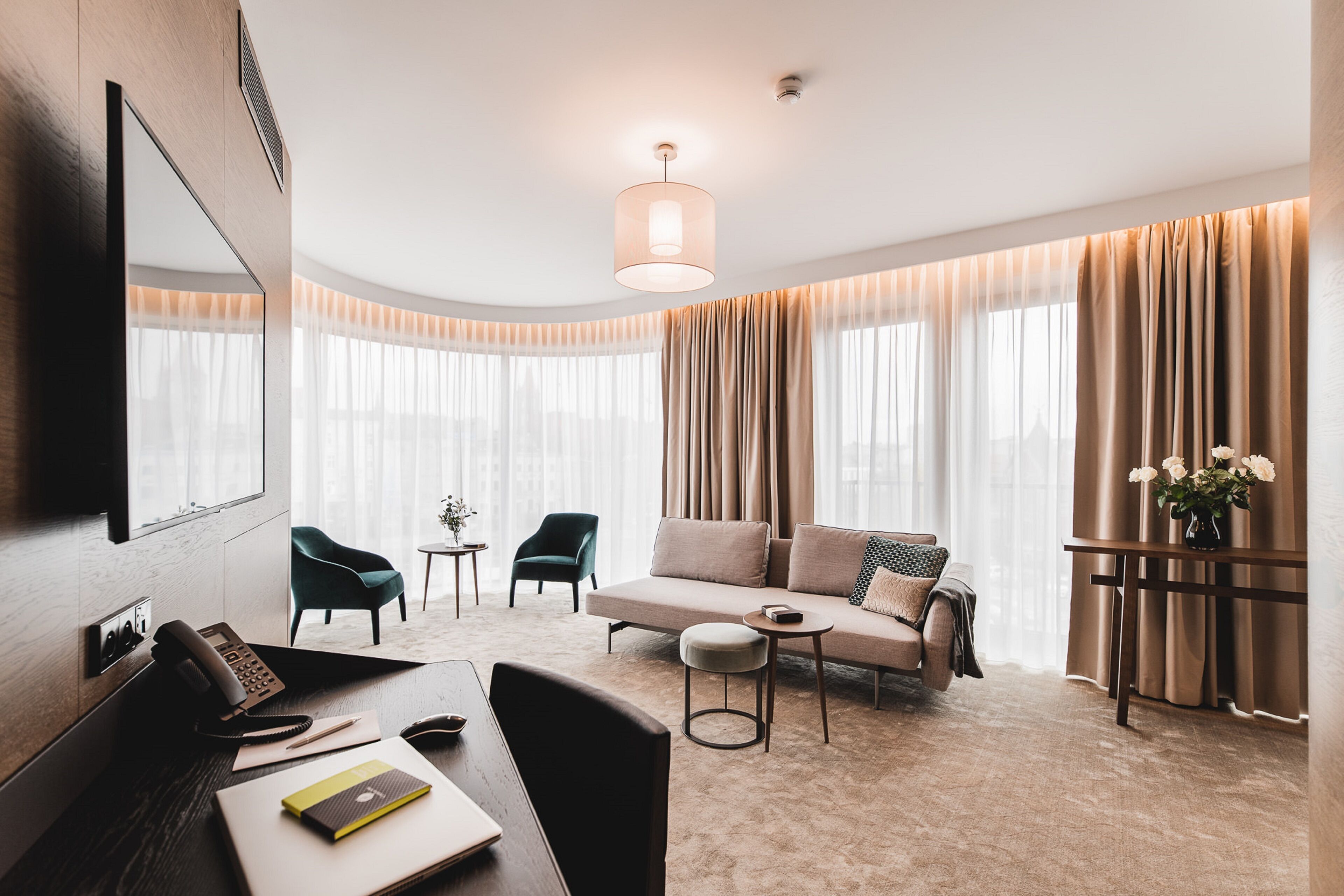 grand apartment | living area | flat-screen tv