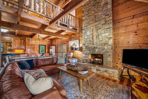 Large authentic 3-story log cabin adjacent to lake. Up to 14 guests.