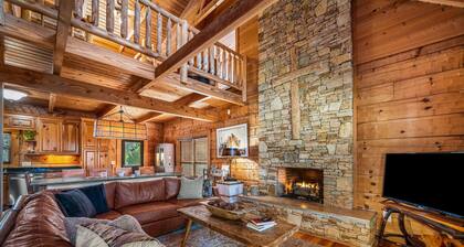 Large authentic 3-story log cabin adjacent to lake. Up to 14 guests.