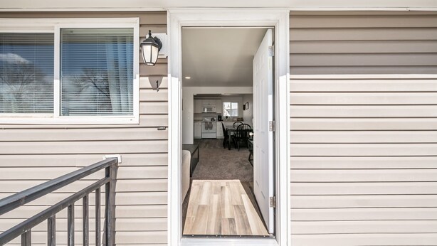 A modern house with a kitchen, dining area, and a staircase leading to the upper floor. - ◆ Sensational Apartment! 2 Bed 1 Bath - Sleeps 4 ◆ (Colorado Springs)