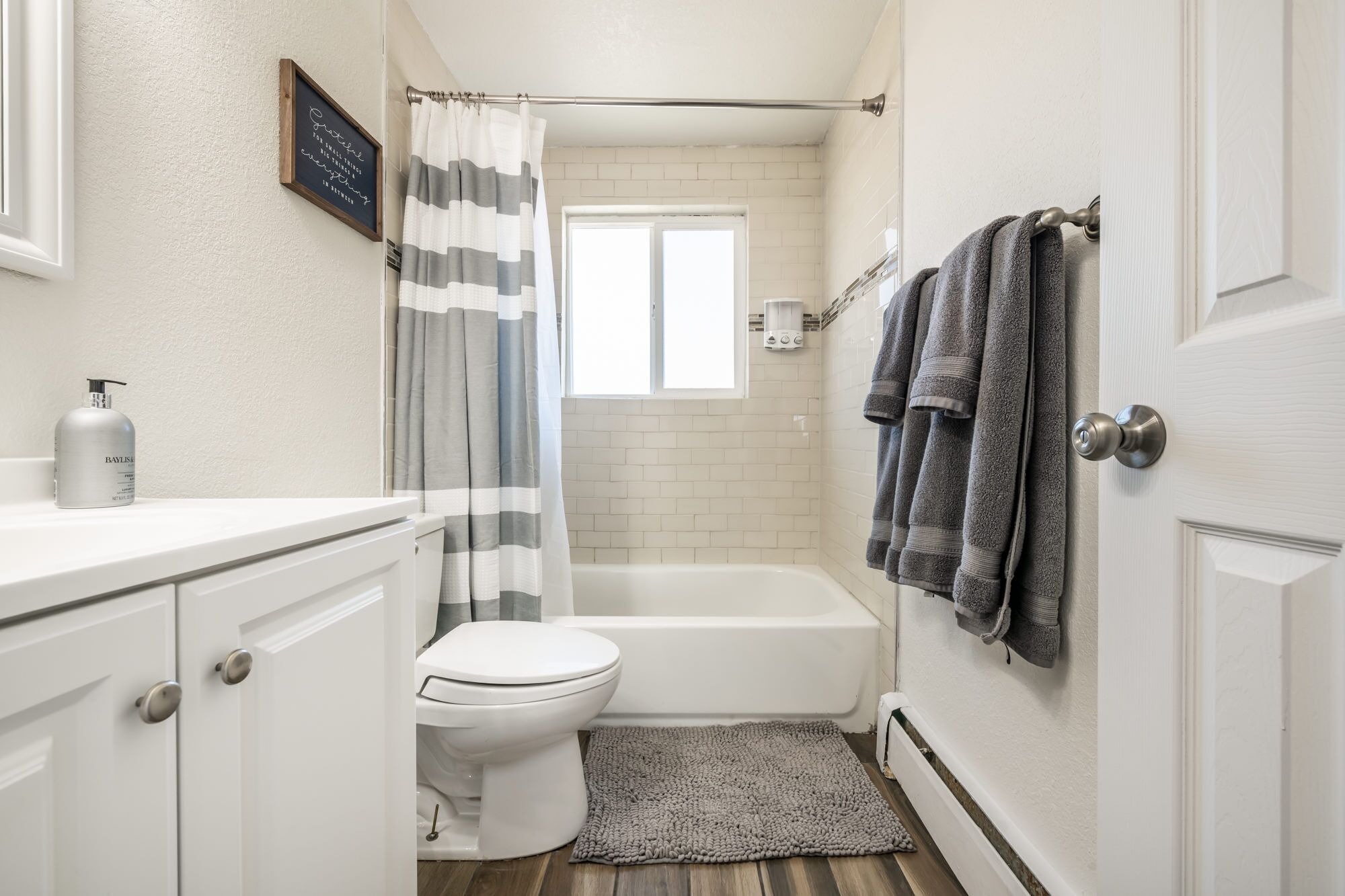 Combined shower/tub, hair dryer, towels, soap