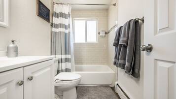 Combined shower/tub, hair dryer, towels, soap