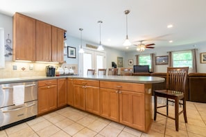Enjoy meals in the kitchen's dining area with a view of the outdoors.