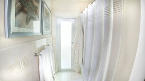 Combined shower/tub, hair dryer, towels, soap