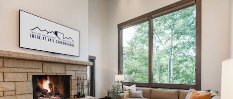 Luxury Condo #406 | Living area | Flat-screen TV, fireplace