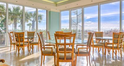 Beachfront 10th-floor condo with Gulf view, pool, gym, & balcony