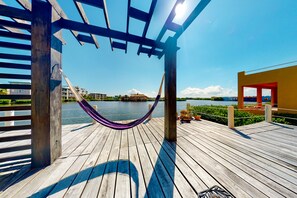 Terrace/patio - Cozy Waterfront Home w/Shared Pool, Water Views, WiFi, & AC - Walk to the Beach (San Pedro)