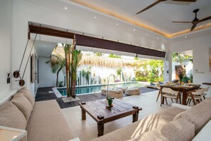 Basic Villa, Multiple Beds | Living area | 32-inch flat-screen TV with digital channels, TV, stereo - Villa Astaga (Seminyak)