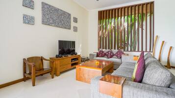 Basic Villa, Multiple Beds | Living room | 43-inch Smart TV with digital channels, streaming services, stereo