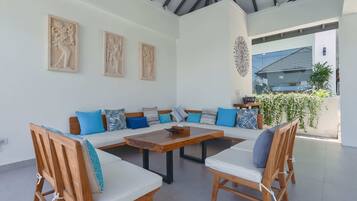 Basic Villa, Multiple Beds | Living room | 32-inch TV with digital channels, streaming services, offices