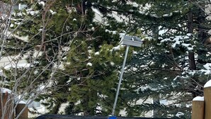 A wooden sign for Cedar Creek Condominiums at 13 Moose Ridge Road. - Cozy Condo Located  Minutes from the Biggest Skiing in America (Big Sky)