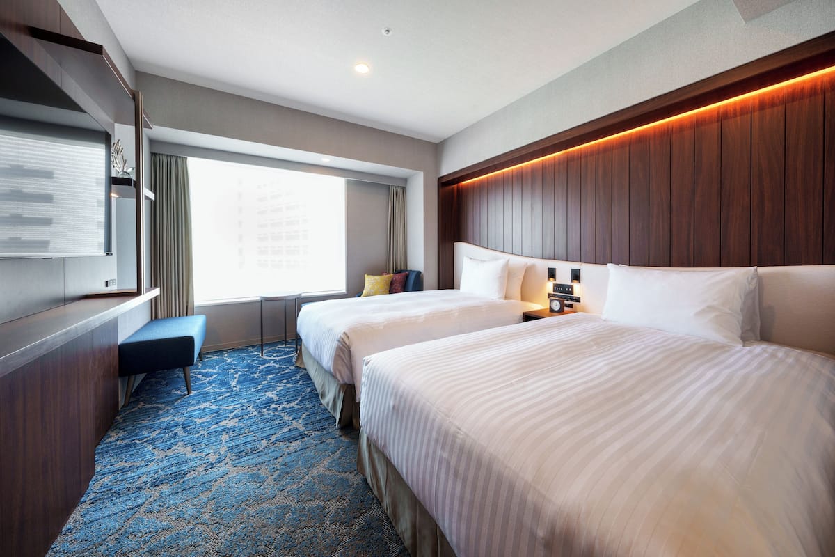 Down duvets, pillow-top beds, in-room safe, desk