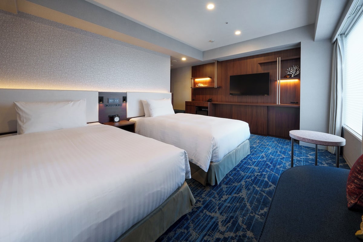 Down duvets, pillow-top beds, in-room safe, desk