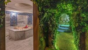 A bathroom with a marble sink, a bathtub, and a shower area. - Litros Hotel & Spa (Istanbul)