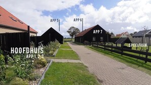 A pathway leading to multiple buildings labeled with 'APP 5', 'APP 6', and 'APP 7'.