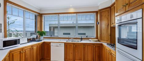 Fridge, cookware/dishes/utensils, dining tables