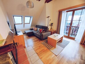 Premium Two Bedroom Apartment with Balcony | Living room | TV, fireplace