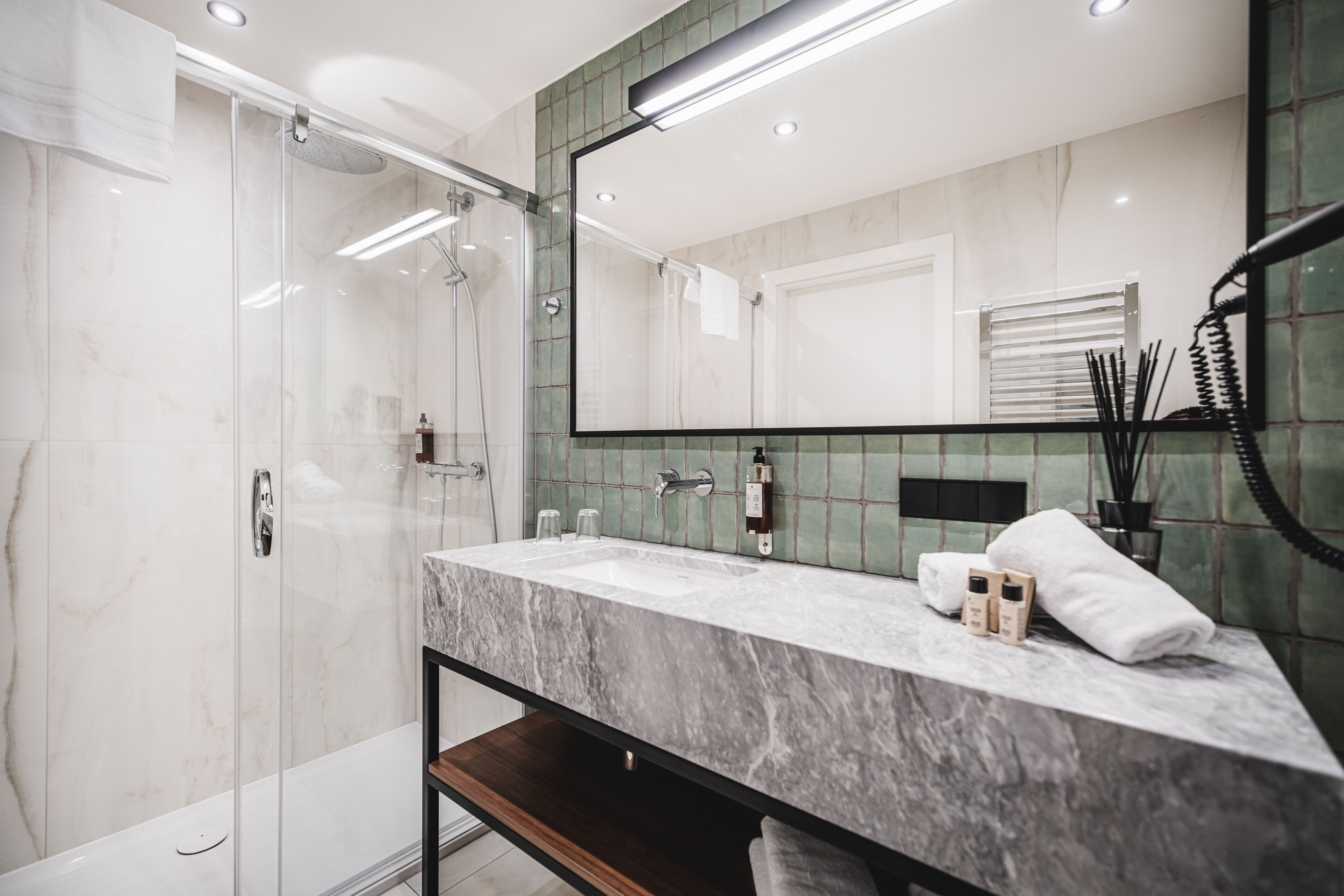 Shower, rainfall showerhead, hair dryer, towels