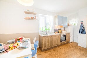 Villa | Private kitchen | Fridge, oven, stovetop, dishwasher
