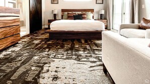 A bedroom with a large bed, a wooden dresser, a sofa, and a large window. - Beautiful Brand NEW Luxury Condo @ Sage Creek (Moab)