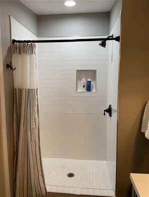 Combined shower/tub, hair dryer, towels, soap