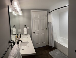 Combined shower/tub, hair dryer, towels, soap