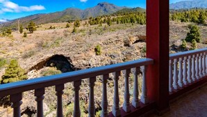 A balcony with a view of a mountainous landscape, featuring rocky terrain and sparse vegetation. - Catalina 4 (El Paso)