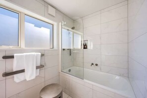 Shower, hair dryer, towels, shampoo