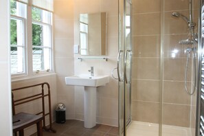 Combined shower/tub, hair dryer, towels, soap