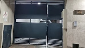 A building entrance with a closed metal gate, a sign indicating 'SUSY RENTAL', and a number '436' on the wall. - Duplex Equipped, with daily cleaning service  (Malargüe)