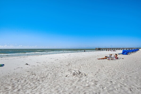 On the beach, sun-loungers, beach towels