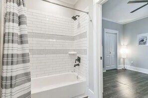 Combined shower/bathtub, hair dryer, towels, soap