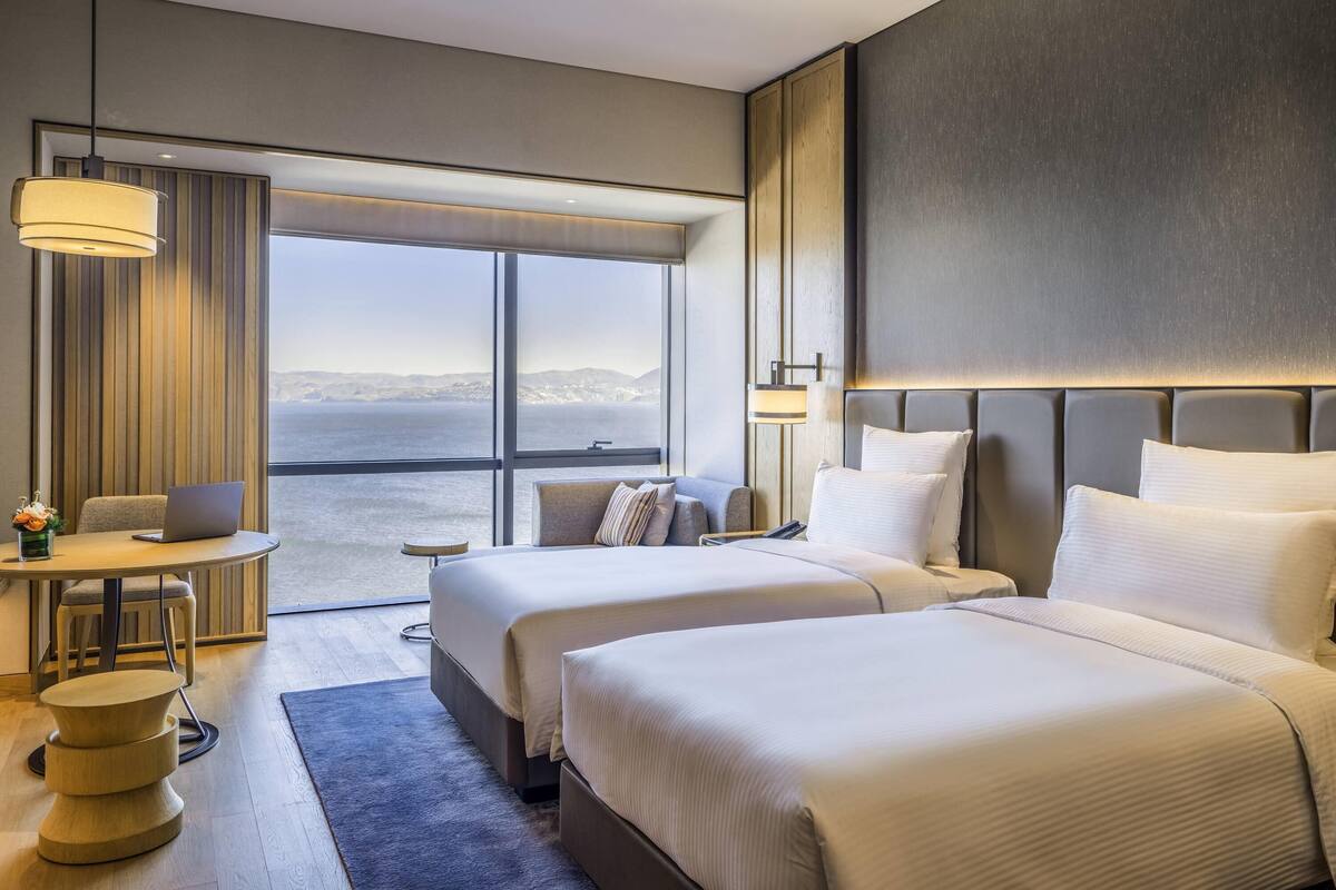 Hypo-allergenic bedding, minibar, desk, rollaway beds