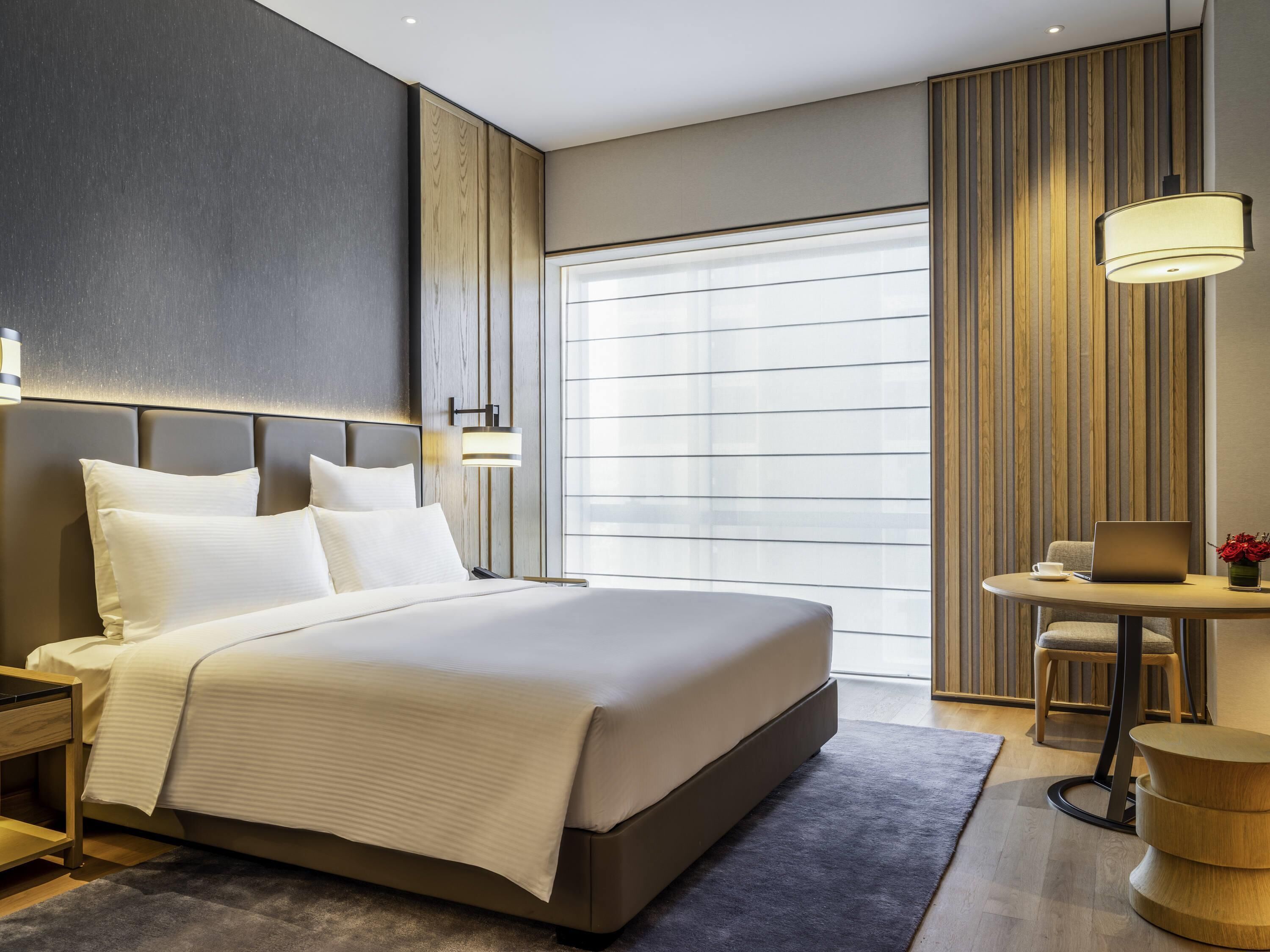 Deluxe Room, 1 King Bed | Hypo-allergenic bedding, minibar, desk, rollaway beds