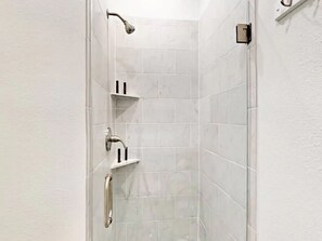 Combined shower/tub, hair dryer, towels, soap