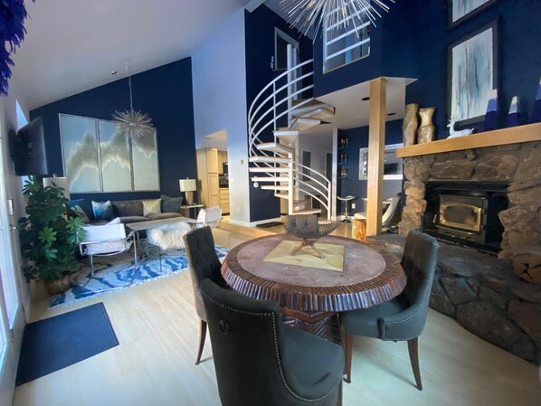 Smart TV, fireplace, books, computer monitors