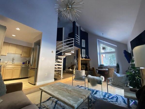 Smart TV, fireplace, books, computer monitors